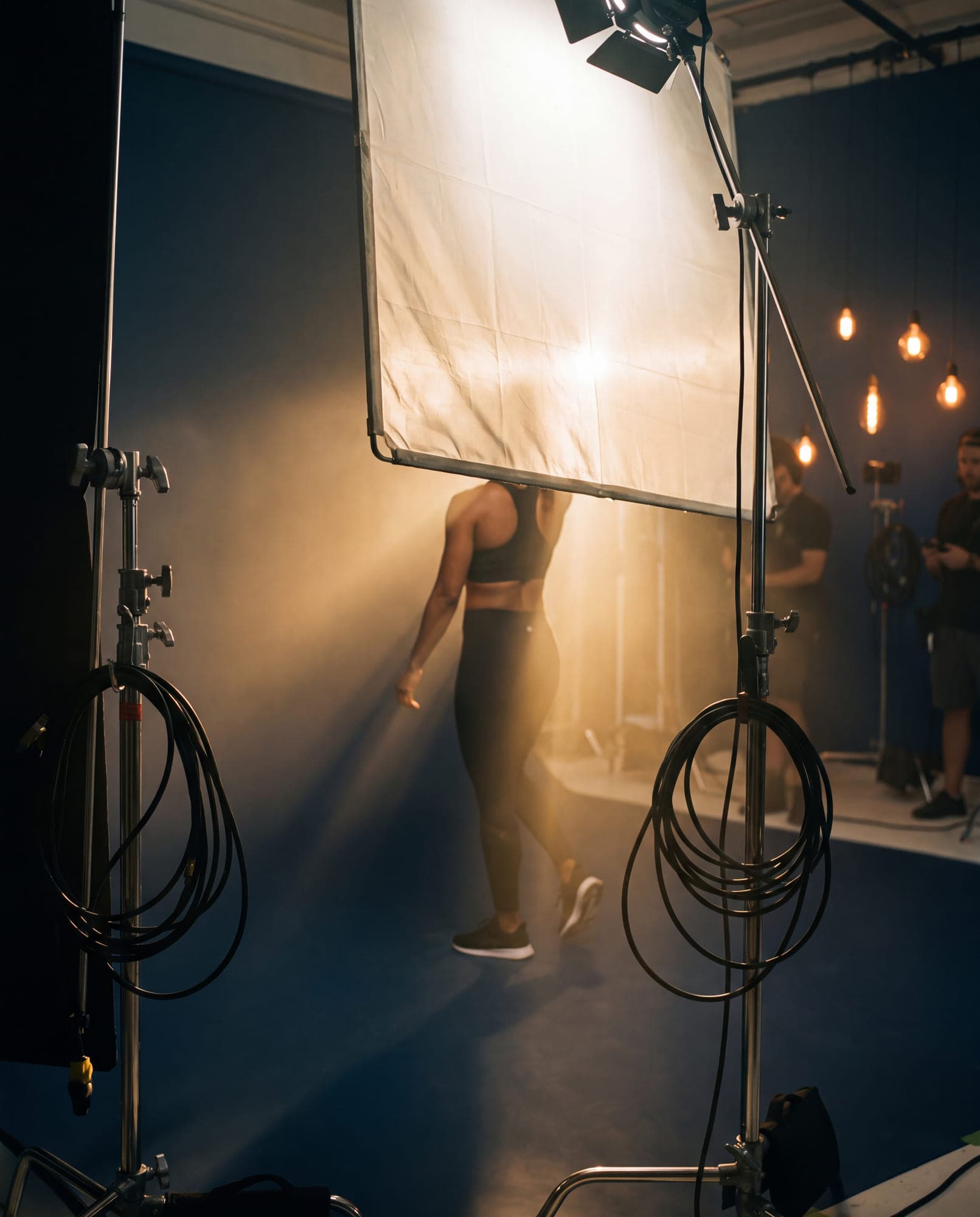 An athlete under studio lighting during a campaign shoot